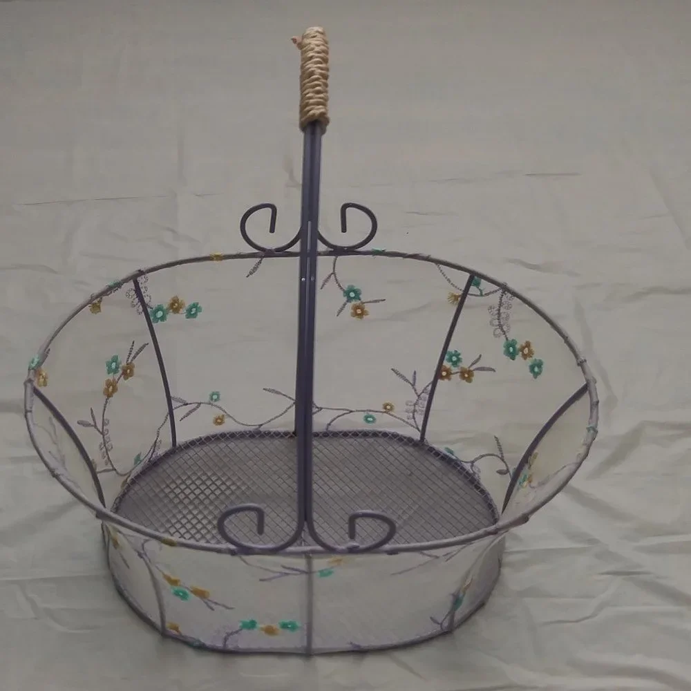 Metallic oval baskets, lined with veil and flower design.